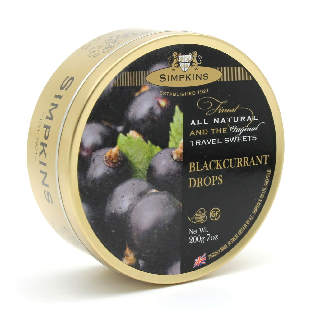 A round tin container of Simpkins Blackcurrent Drops with an image of blackcurrants on the label.