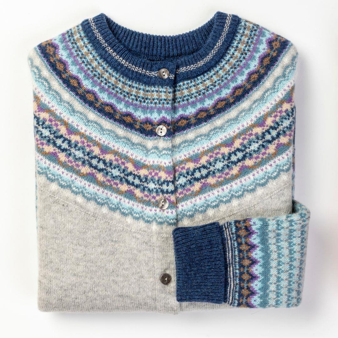 a folded fairisle knit cardigan in arctic colours of grey, blue, white and lavender